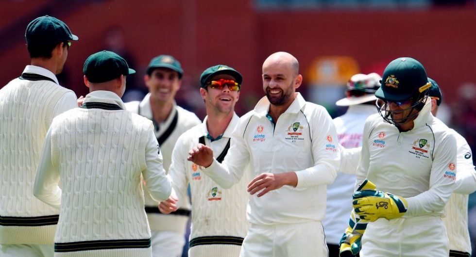 Nathan Lyon celebrates his wicket of Pakistan's Shan Masood with teammates on day four of the second cricket Test match between Australia and Pakistan in Adelaide