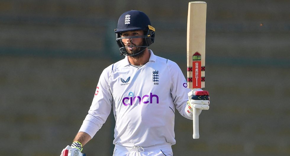Ben Foakes raises his bat for his half-century during the third Pakistan-England Test
