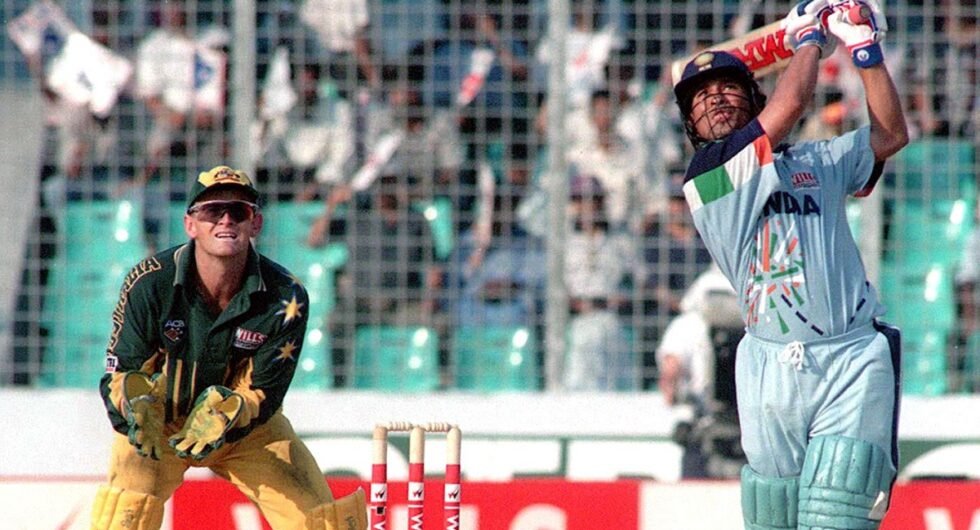 Adam Gilchrist watches as Sachin Tendulkar lofts a six during his i141 off 127 balls in the mini World Cup quarter-final at National Stadium, Dhaka on Oct 28. 1998
