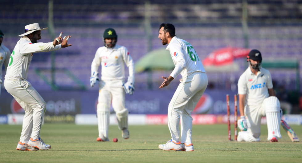 Salman Agha celebrates the wicket of Daryl Mitchell on day one of the second Pakistan-New Zealand Test at Karachi