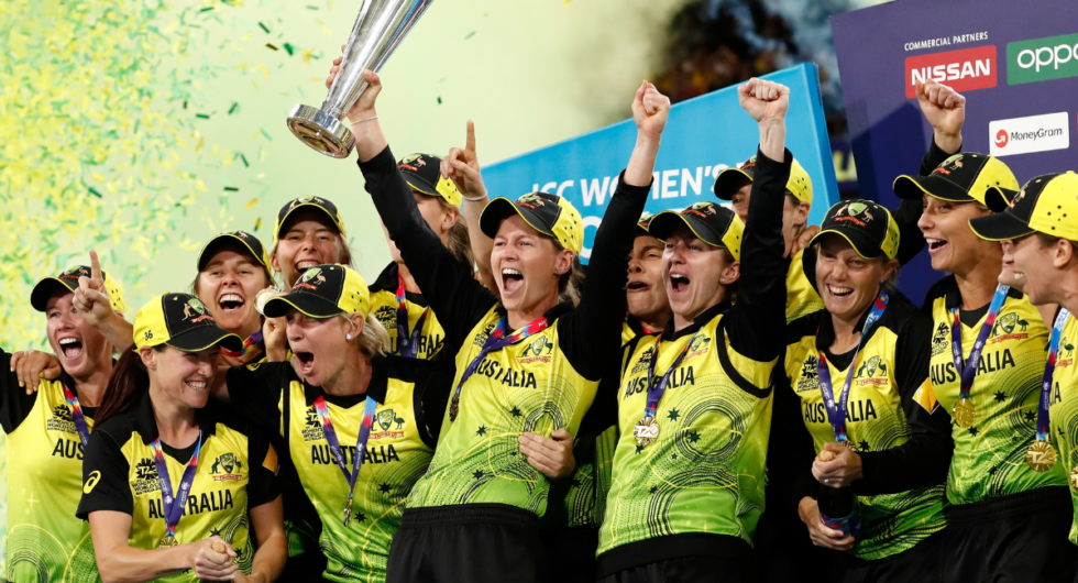 Meg Lanning of Australia holds aloft the championship trophy and celebrates with team mates after winning the ICC Women's T20 Cricket World Cup Final