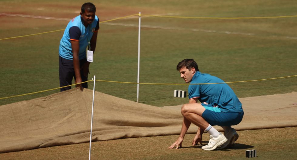 Australia Test captain Pat Cummins examines the Nagpur pitch ahead of the first Test against India