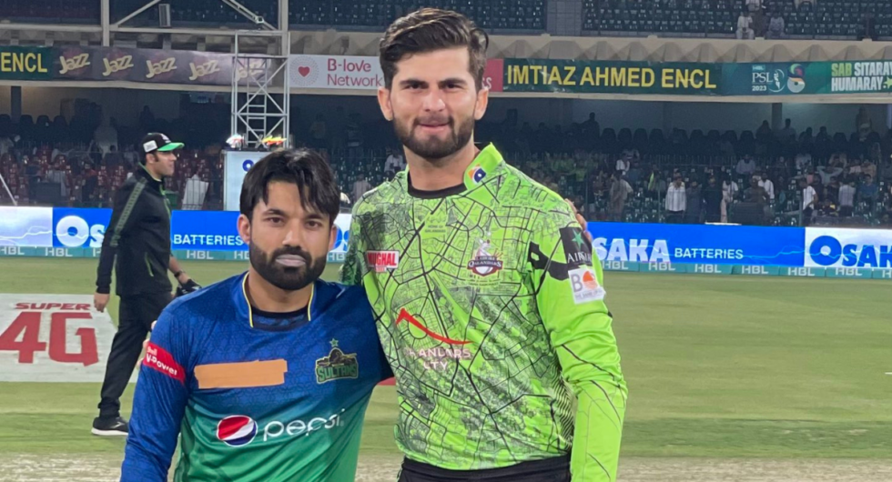 Mohammad Rizwan at the toss with tape covering the Wolf777 News logo on his Multan Sultans jersey