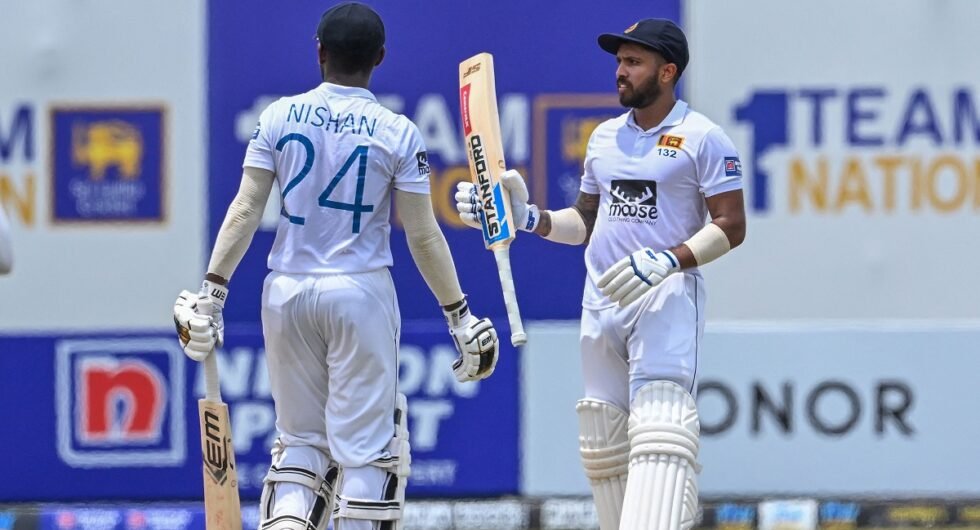 Sri Lanka's Kusal Mendis (R) celebrates after scoring (150 runs) as teammate Nishan Madushka looks on during fourth day of the second and final cricket Test match between Sri Lanka and Ireland at the Galle International Cricket Stadium in Galle on April 27, 2023