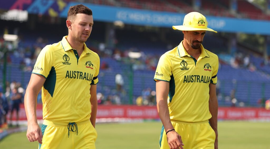 Josh Hazlewood, Mitchell Starc wearing black armbands