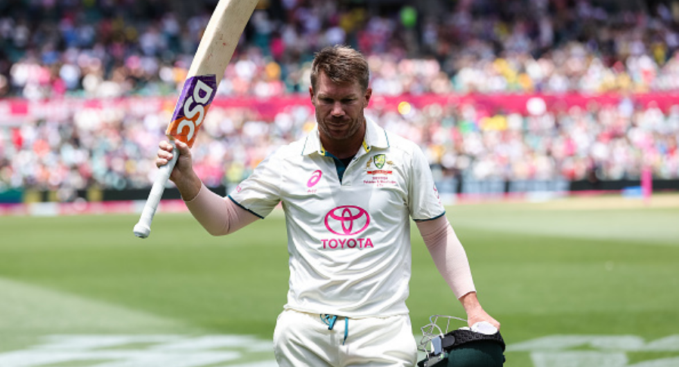 David Warner of Australia raises his bat to the crowd after getting out in his last test match during Day 4 of the third test match between Australia and Pakistan at the Sydney Cricket Ground on January 06