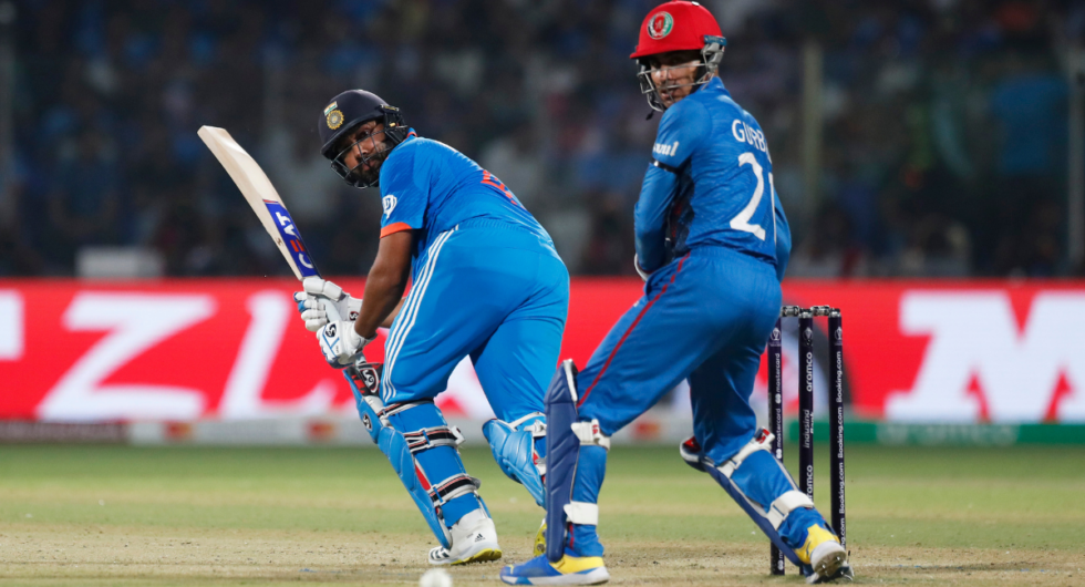 Rohit Sharma of India plays a shot as Rahmanullah Gurbaz of Afghanistan keeps during the ICC Men's Cricket World Cup India 2023 between India and Afghanistan at Arun Jaitley Stadium on October 11, 2023 in Delhi, India.
