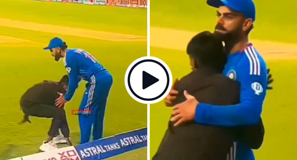 Virat Kohli hugs pitch invader fan