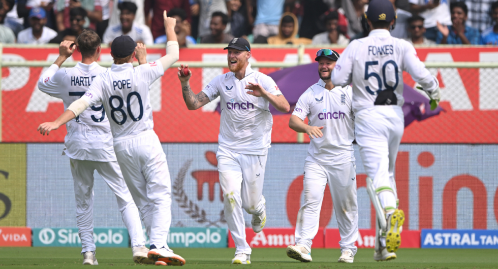 England celebrate in the field against India