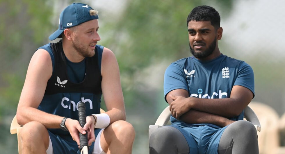 Ollie Robinson in conversation with Rehan Ahmed at an England training session before the third Test at Rajkot
