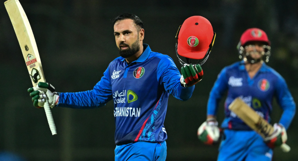 Afghanistan's Mohammad Nabi celebrates after scoring a century (100 runs) during the first one-day international (ODI) cricket match between Sri Lanka and Afghanistan at the Pallekele International Cricket Stadium in Kandy on February 9, 2024.