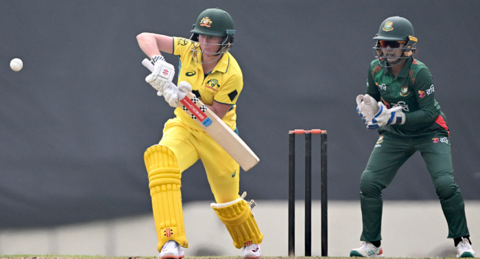 Australia's Beth Mooney (L) plays a shot during the first one-day international (ODI) cricket match between Bangladesh and Australia at Sher-e-Bangla National Cricket Stadium in Dhaka on March 21, 2024.