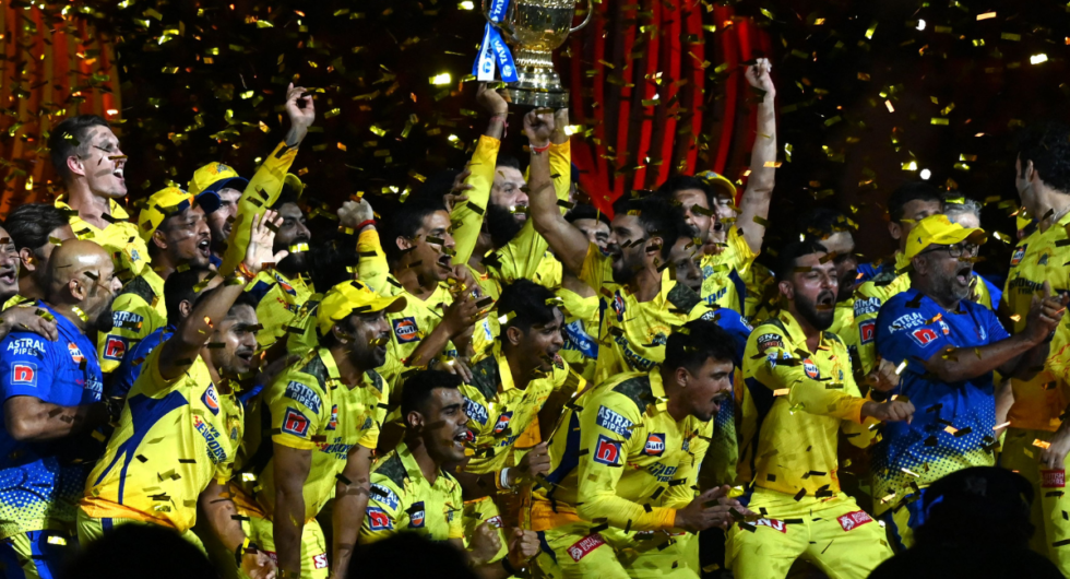 Chennai Super Kings' players celebrate with the trophy after their victory against Gujarat Titans in the Indian Premier League (IPL) Twenty20 final cricket match at the Narendra Modi Stadium in Ahmedabad on May 30, 2023.