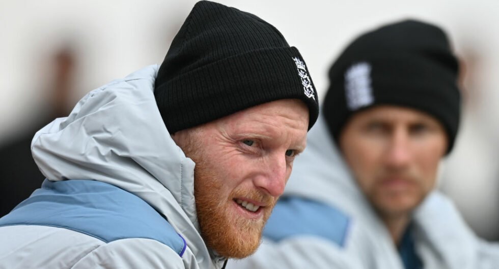 Ben Stokes and Joe Root sit next to each other in Dharamshala