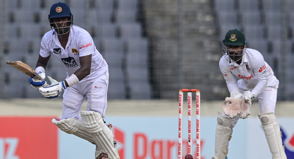 Sri Lanka's Angelo Mathews (L) plays a shot during the fourth day of the second Test cricket match between Bangladesh and Sri Lanka at the Sher-e-Bangla National Cricket Stadium in Dhaka on May 26, 2022.