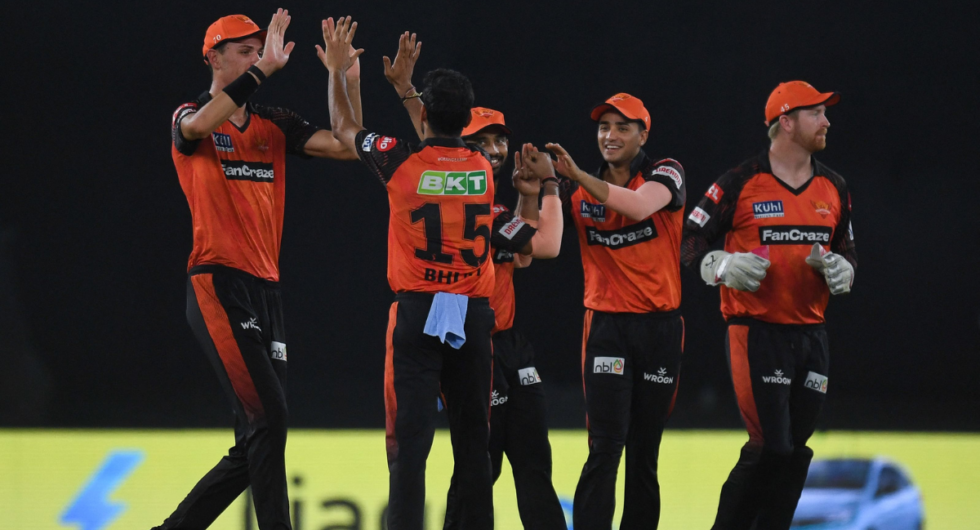 Sunrisers Hyderabad's players celebrate after the dismissal of Gujarat Titans' Wriddhiman Saha (not pictured) during the Indian Premier League (IPL) Twenty20 cricket match between Gujarat Titans and Sunrisers Hyderabad at the Narendra Modi Stadium in Ahmedabad on May 15, 2023.