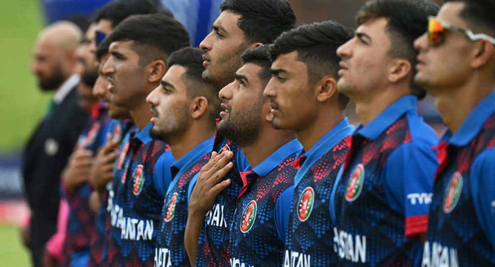 Players of Afghanistan line up for the National Anthems ahead of the ICC U19 Men's Cricket World Cup South Africa 2024 match between New Zealand and Afghanistan at Buffalo Park on January 23, 2024 in East London, South Africa.