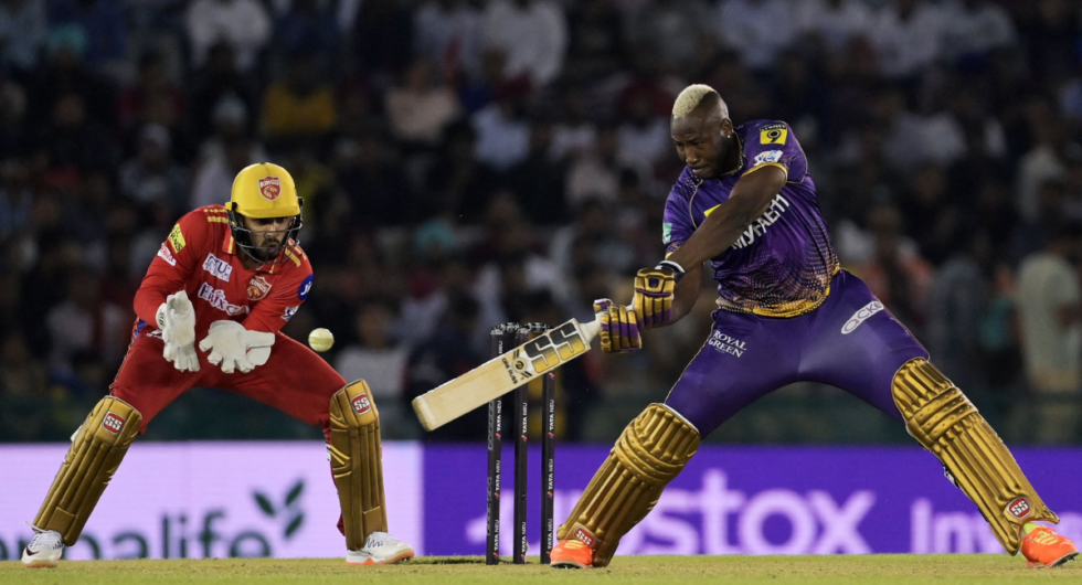 Kolkata Knight Riders' Andre Russell (R) plays a shot during the Indian Premier League (IPL) Twenty20 cricket match between Punjab Kings and Kolkata Knight Riders at the Punjab Cricket Association I.S. Bindra stadium in Mohali on April 1, 2023.