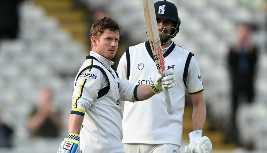 Alex Davies raises his bat after reaching his first County Championship hundred of the 2024 season