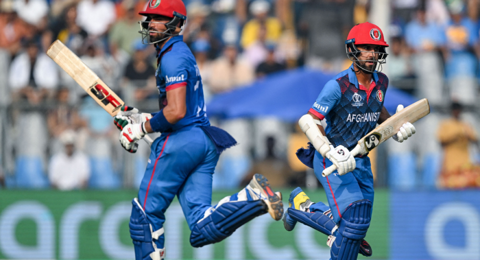 Afghanistan's captain Hashmatullah Shahidi and Ibrahim Zadran (L) run between the wickets during the 2023 ICC Men's Cricket World Cup one-day international (ODI) match between Australia and Afghanistan at the Wankhede Stadium in Mumbai on November 7, 2023.