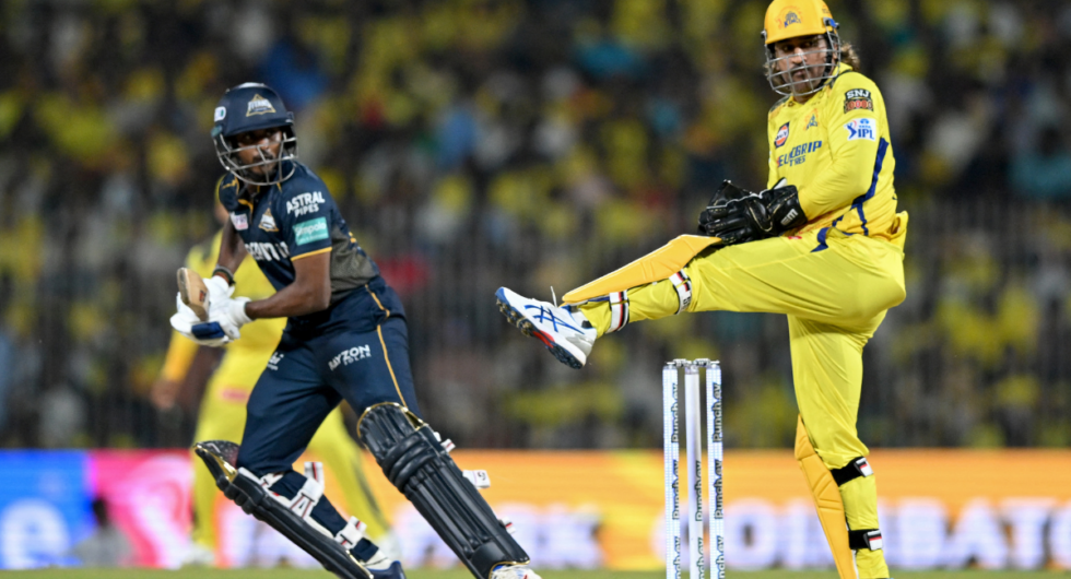 Gujarat Titans' Sai Sudharsan (L) reacts after playing a shot as Chennai Super Kings' wicketkeeper MS Dhoni looks on during the Indian Premier League (IPL) Twenty20 cricket match between Chennai Super Kings and Gujarat Titans at the MA Chidambaram Stadium in Chennai on March 26, 2024.