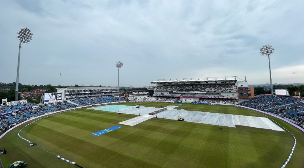 A general view of the inside of the stadium as members of the Grounds Staff team tend to the pitch, as rain covers can be seen, during the rain delay prior to Day Three of the LV= Insurance Ashes 3rd Test Match between England and Australia at Headingley on July 08, 2023 in Leeds, England.