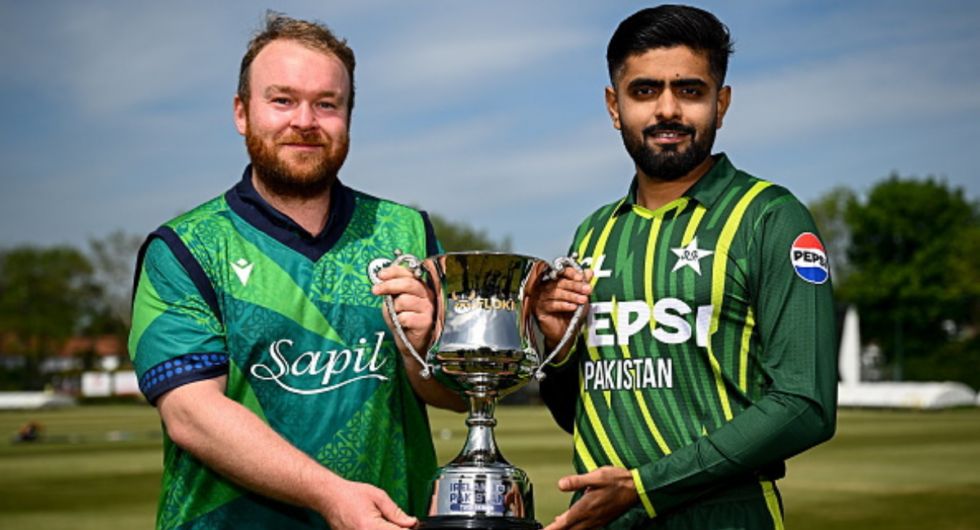 Ireland captain Paul Stirling, left, and Pakistan captain Babar Azam with the trophy during a captains photocall at Castle Avenue Cricket Ground in Dublin, ahead of the Men's T20 International Series between Ireland and Pakistan.