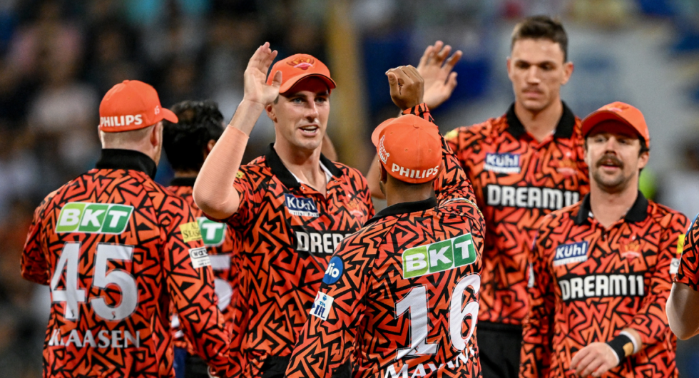 Sunrisers Hyderabad's Marco Jansen (2R) celebrates with captain Pat Cummins (3L) and teammates after taking the wicket of Mumbai Indians' Ishan Kishan (not pictured) during the Indian Premier League (IPL) Twenty20 cricket match between Mumbai Indians and Sunrisers Hyderabad at the Wankhede Stadium in Mumbai on May 6, 2024.