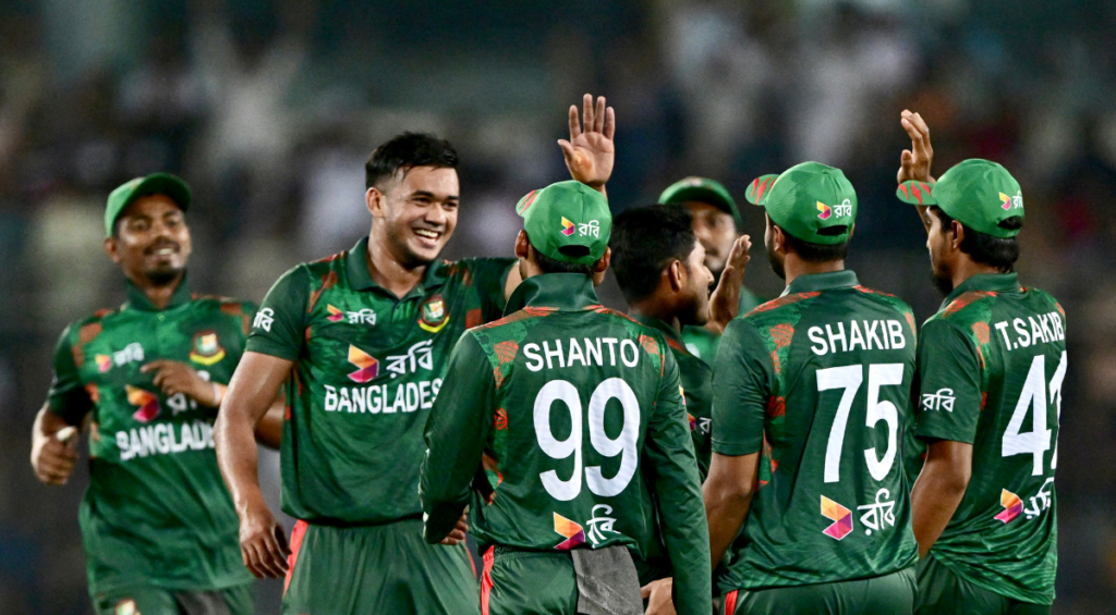 Bangladesh's Taskin Ahmed (2L) celebrates with teammates after taking the wicket of Zimbabwe's Brian Bennett (not pictured) during the fourth Twenty20 international cricket match between Bangladesh and Zimbabwe at the at Sher-e-Bangla National Cricket Stadium in Dhaka on May 10, 2024.