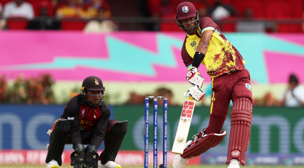 Roston Chase of West Indies plays a shot as Kiplin Doriga of Papua New Guinea keeps during the ICC Men's T20 Cricket World Cup West Indies & USA 2024 match between West Indies and Papua New Guinea at Providence Stadium on June 02, 2024 in Georgetown, Guyana.